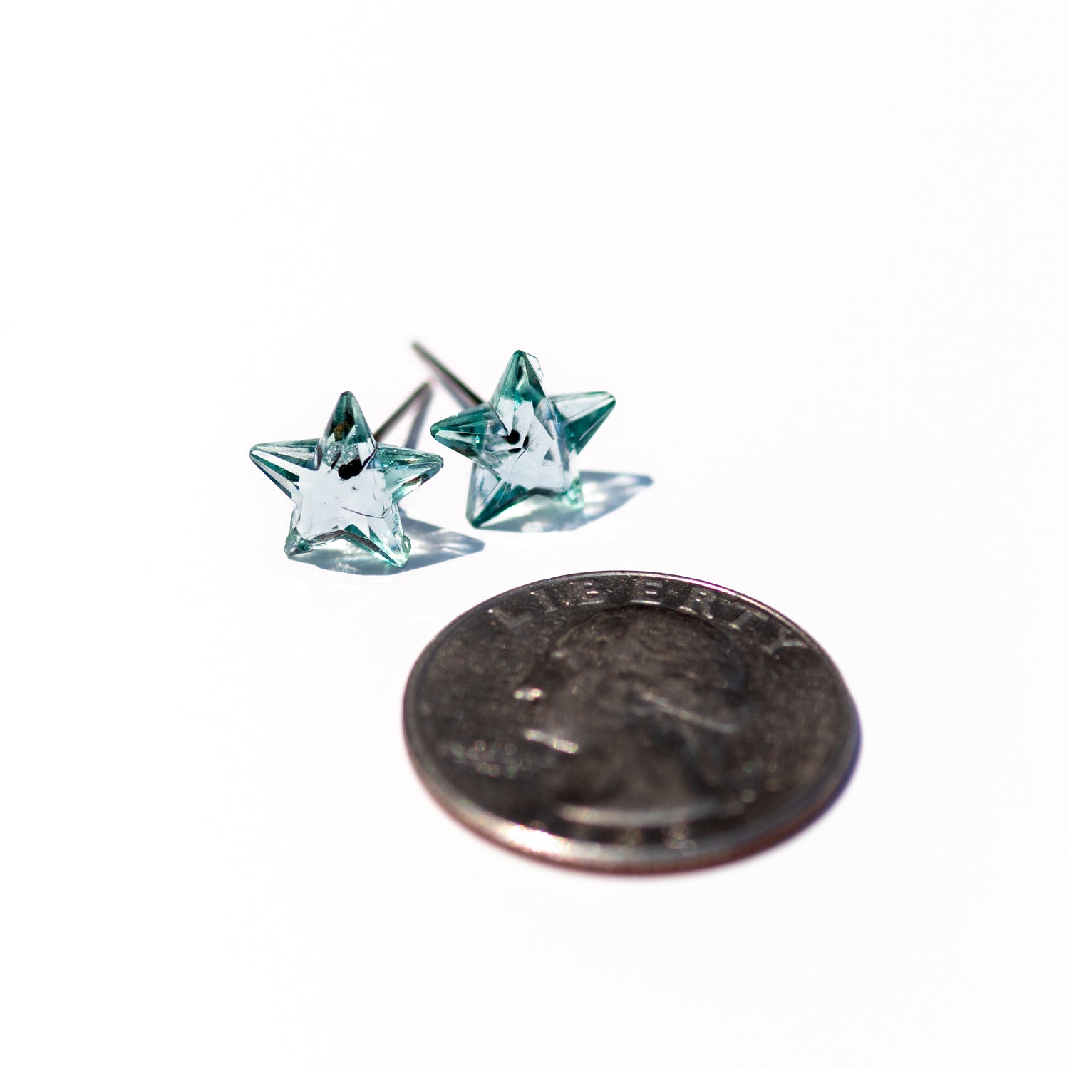 mini star earrings green