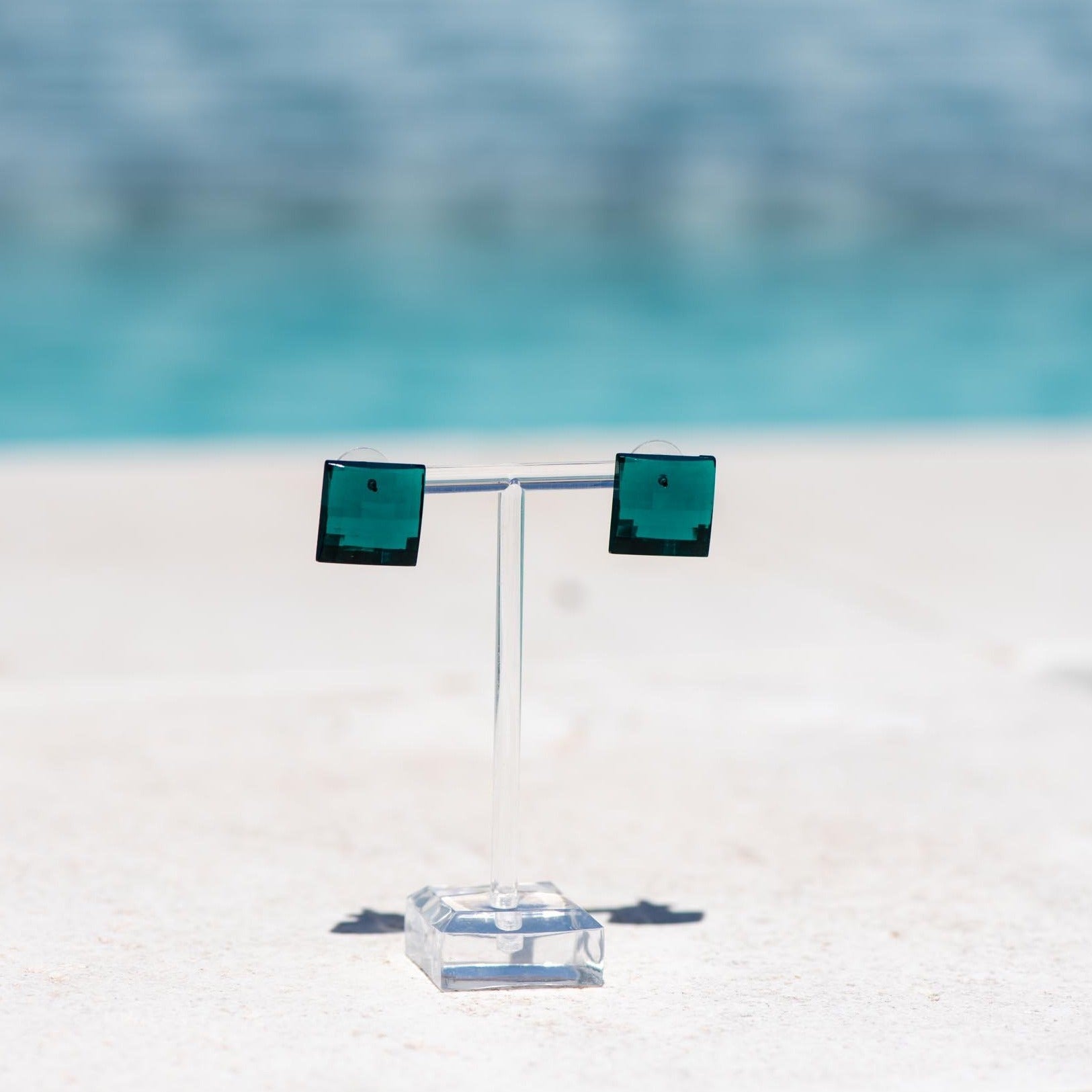 green faceted square studs