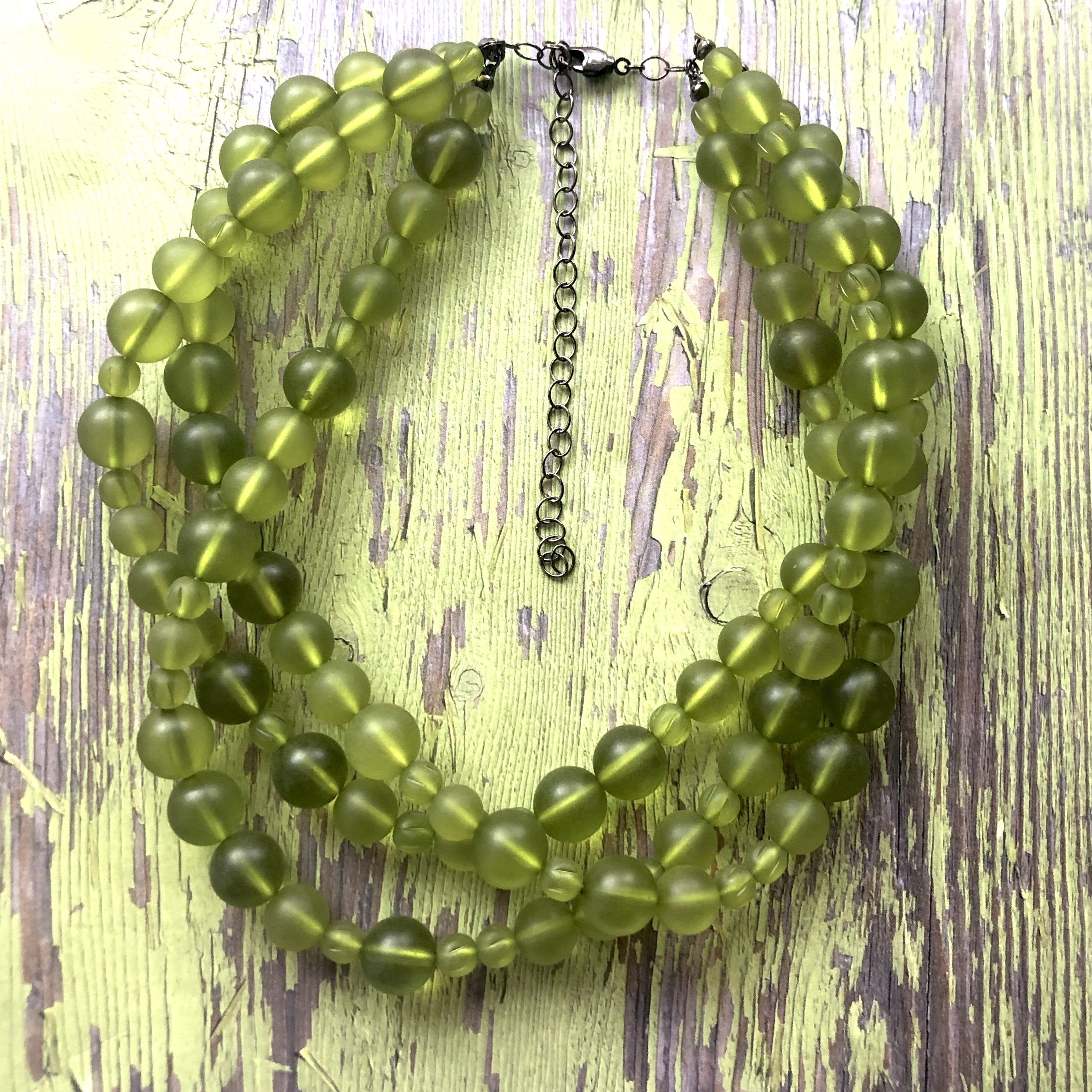 Gold Finish Olive Green Cotton Thread Long Boho Necklace Design by ZAZA BY  SOMYA at Pernia's Pop Up Shop 2024