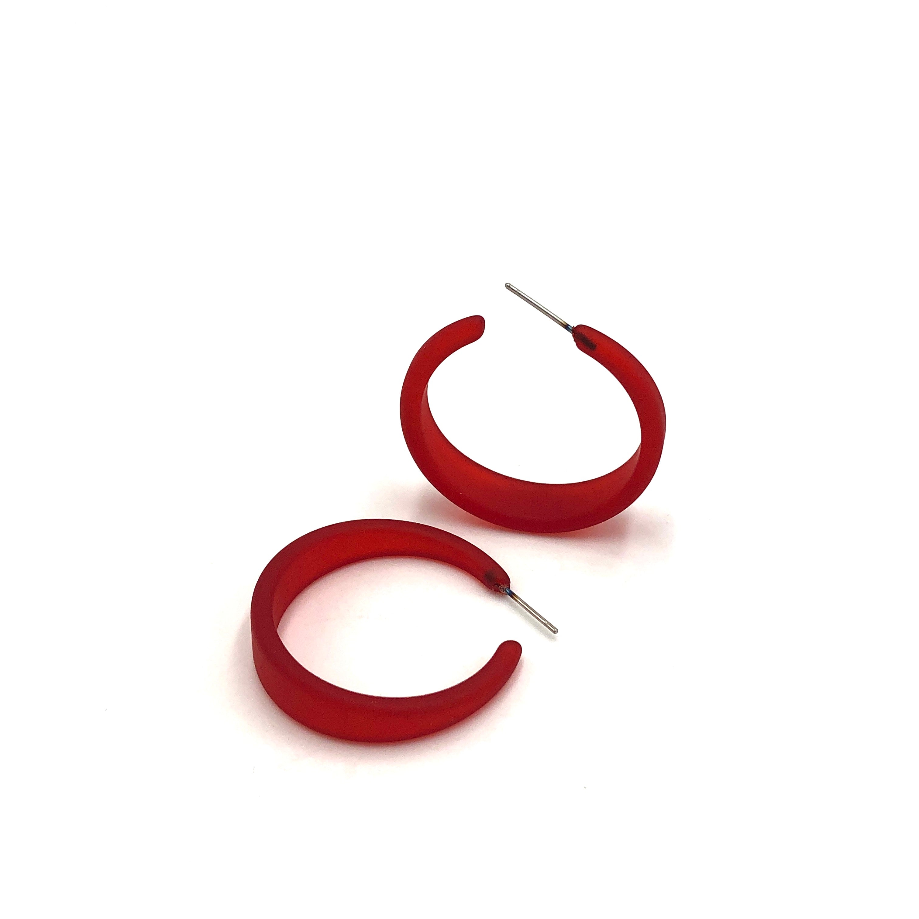 red tapered earrings