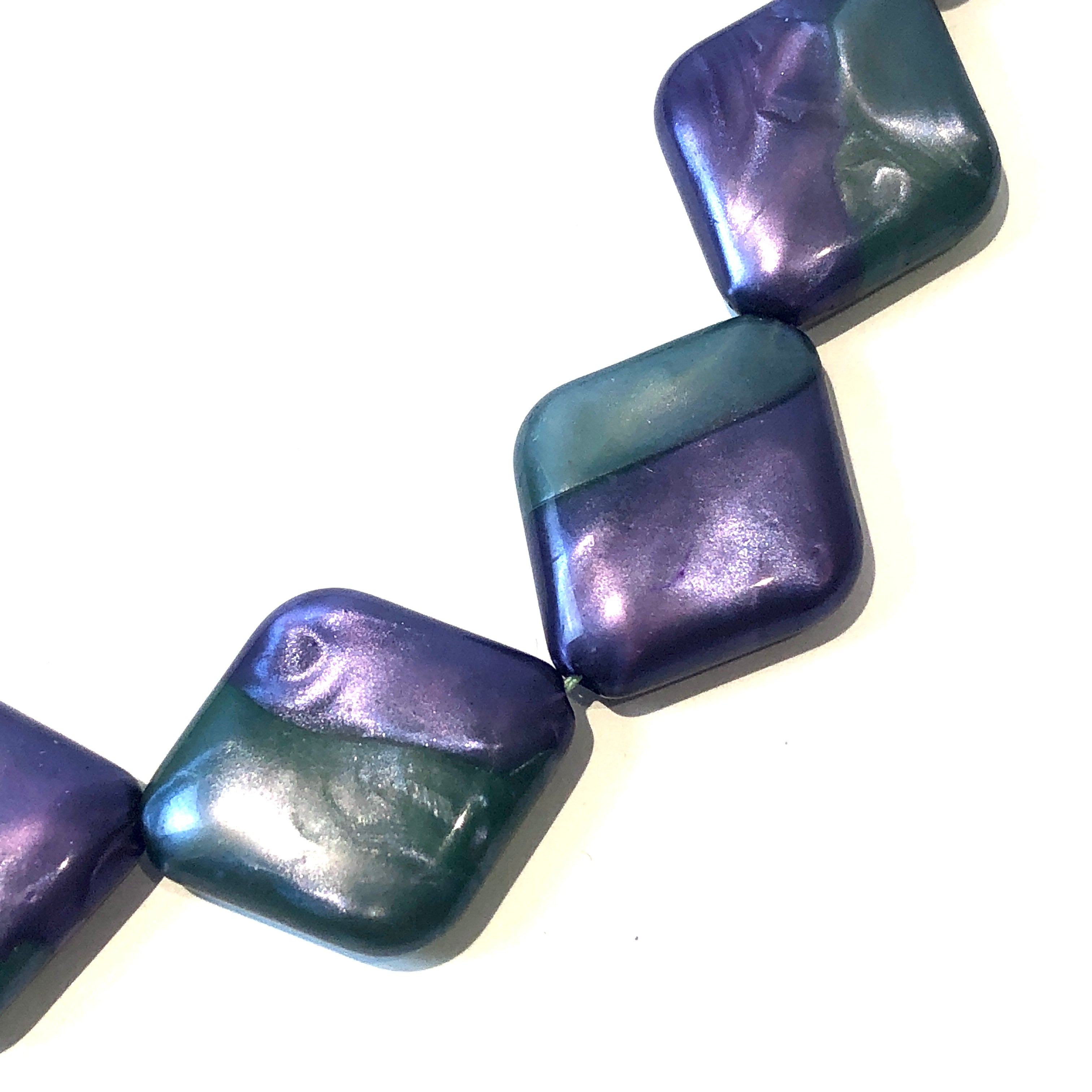 closeup purple green beads