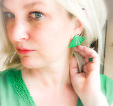 green earrings on girl