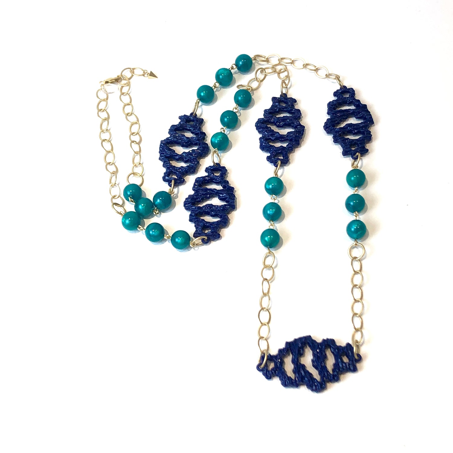 long gold necklace with blue