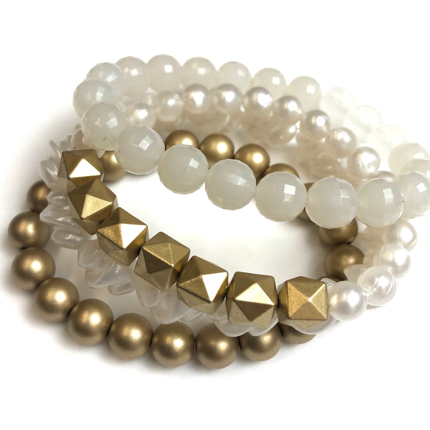 gold and white bracelets