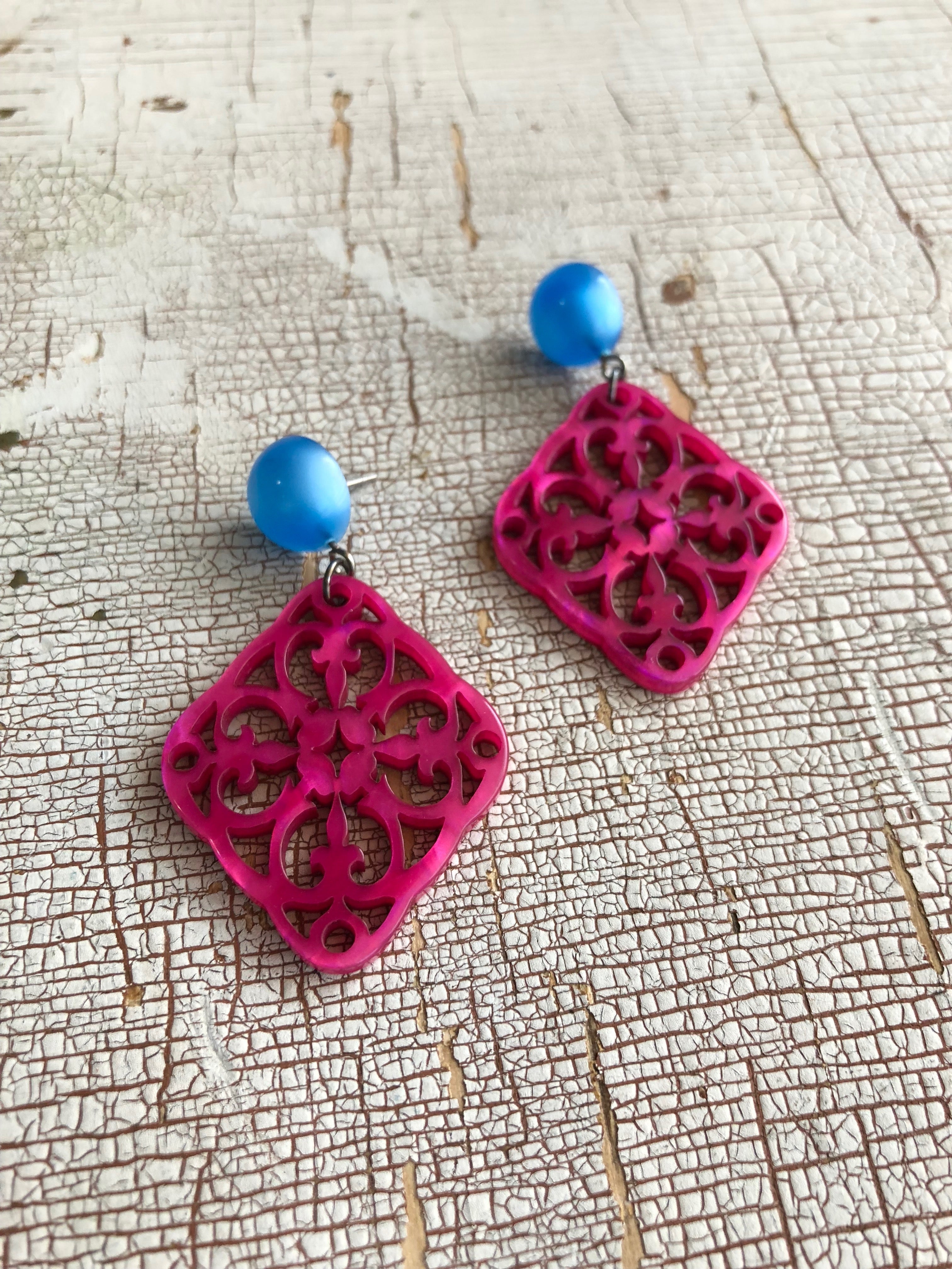 pink statement earrings