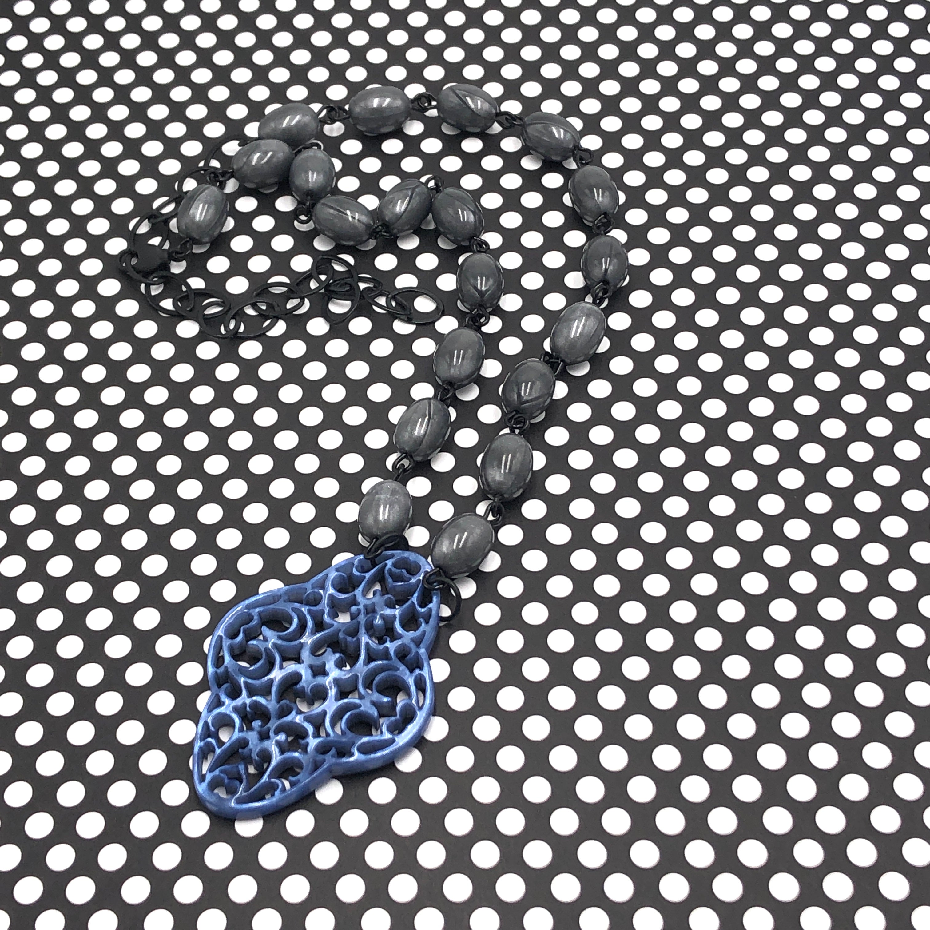 gray necklace with blue
