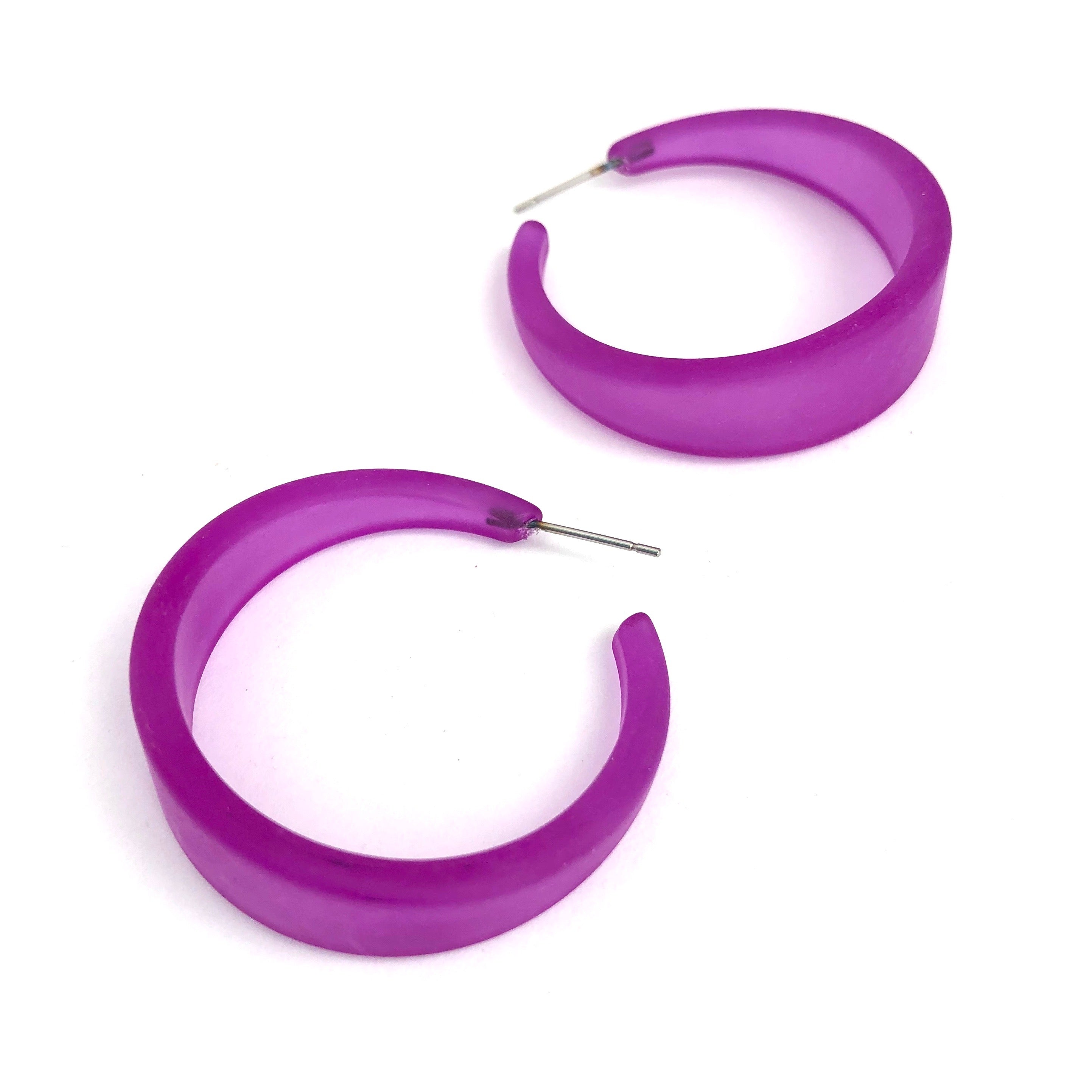 violet tapered earrings