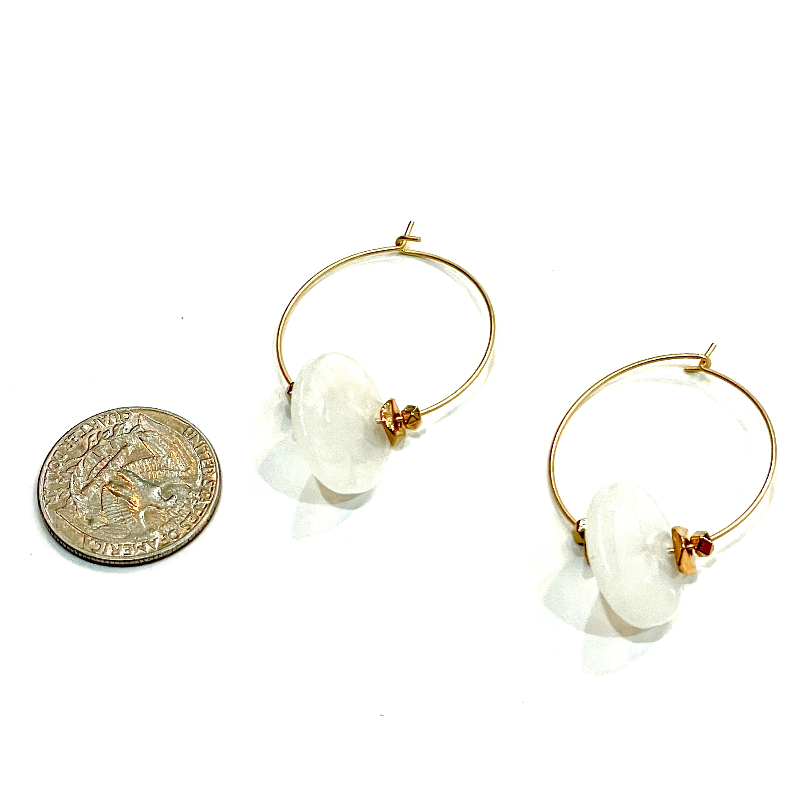 gold earrings with white disc