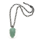 carved light jade pendant