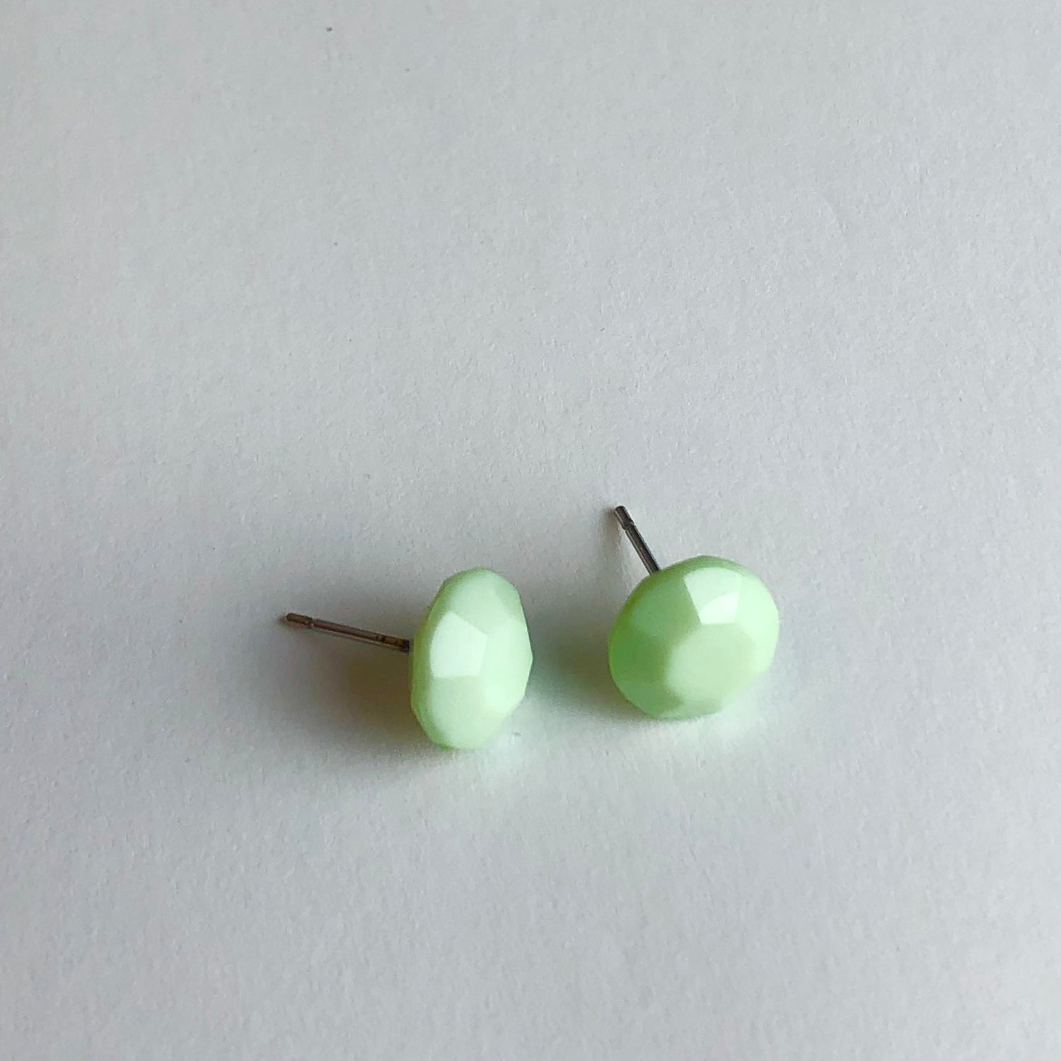 pastel green faceted studs