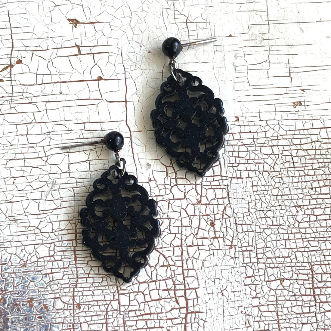 carved black earrings
