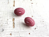 red nordic studs