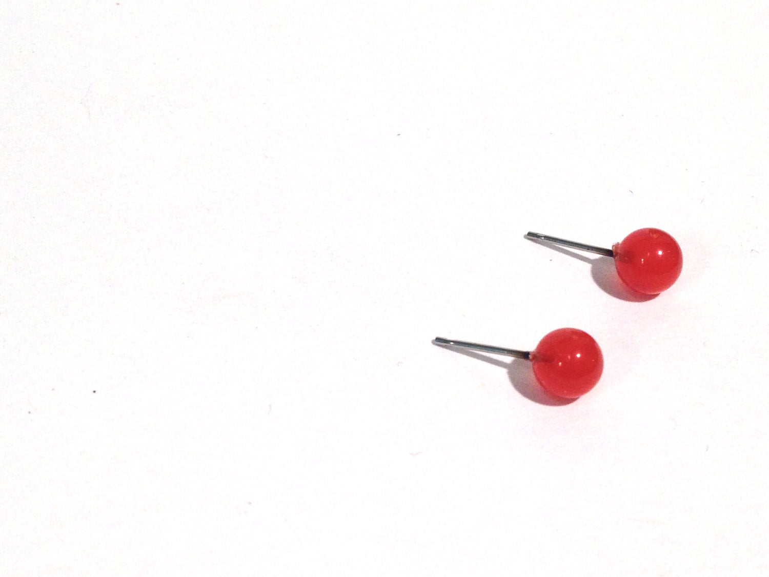 small red lucite studs