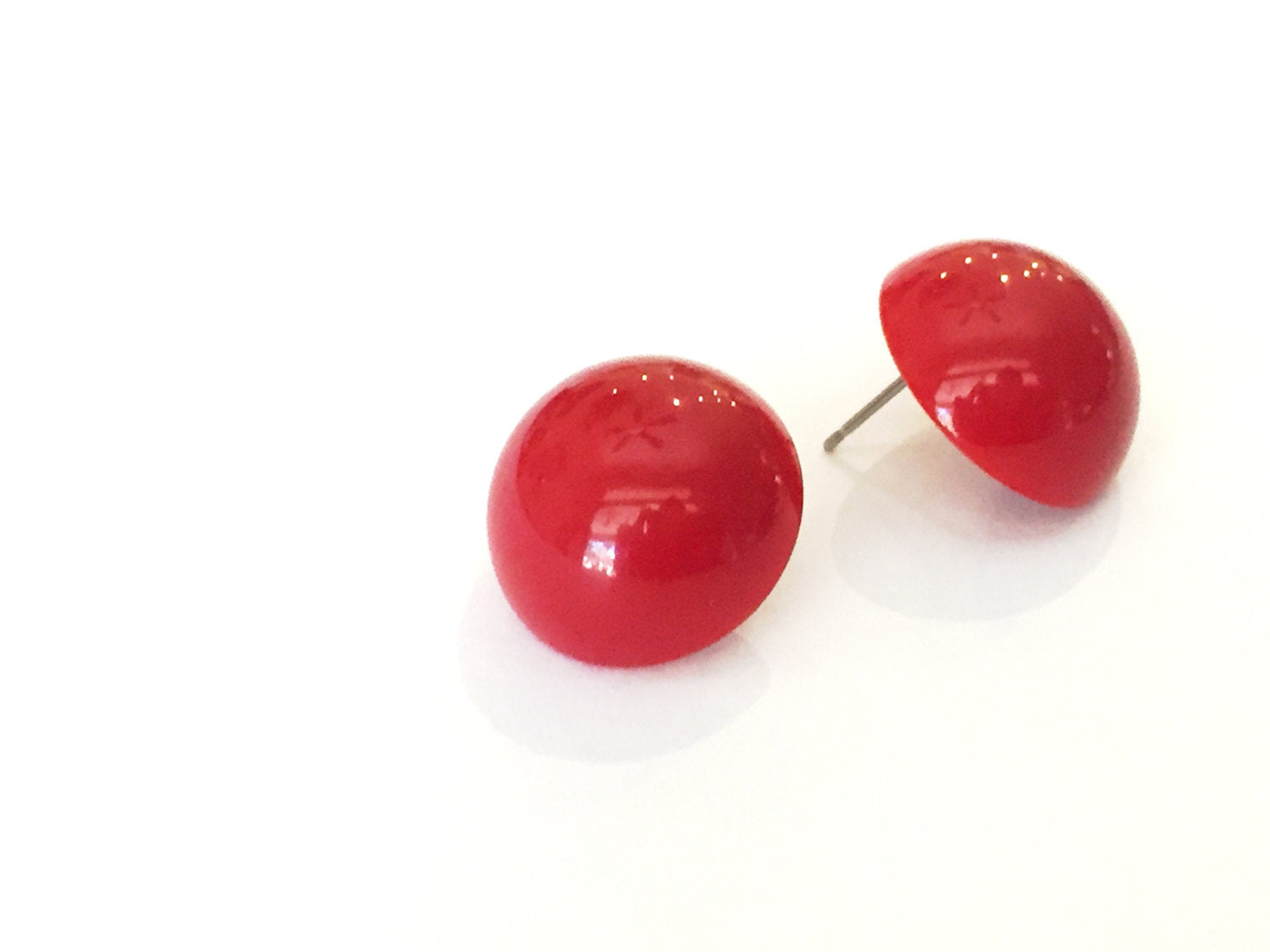 red plastic earrings