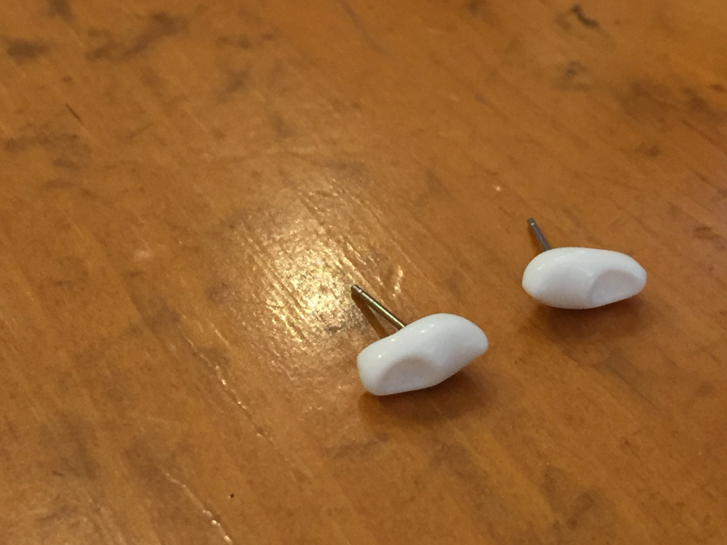 tiny clog earrings white